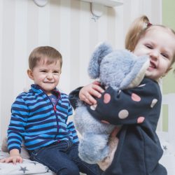 brother-sister-playing-children-room